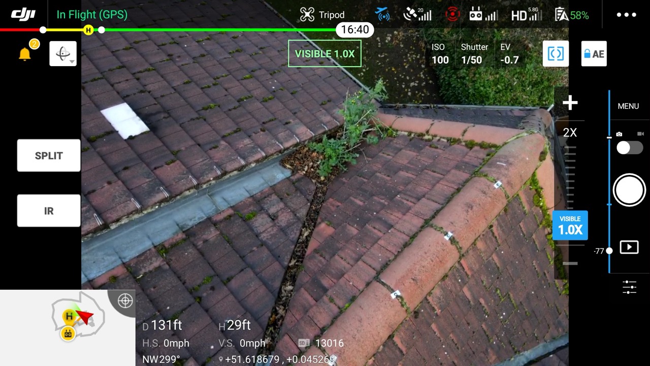 Comprehensive gutter assessment identifies blockages and structural defects from above Aerial drone view of residential guttering system showing blockages and maintenance requirements